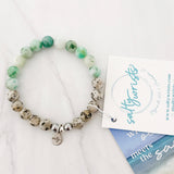 Aqua tides or beachy blues with sandy jaspers