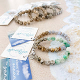 Aqua tides or beachy blues with sandy jaspers