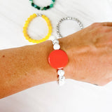 Howlite with large coral colored circle accent
